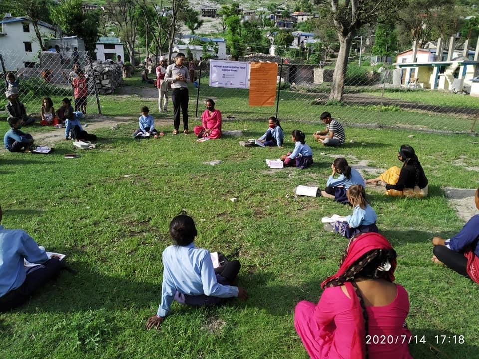 Budhinanda Basic School of Kolti, Bajura organized outdoor teaching with parents/guardians present to ensure continued learning 