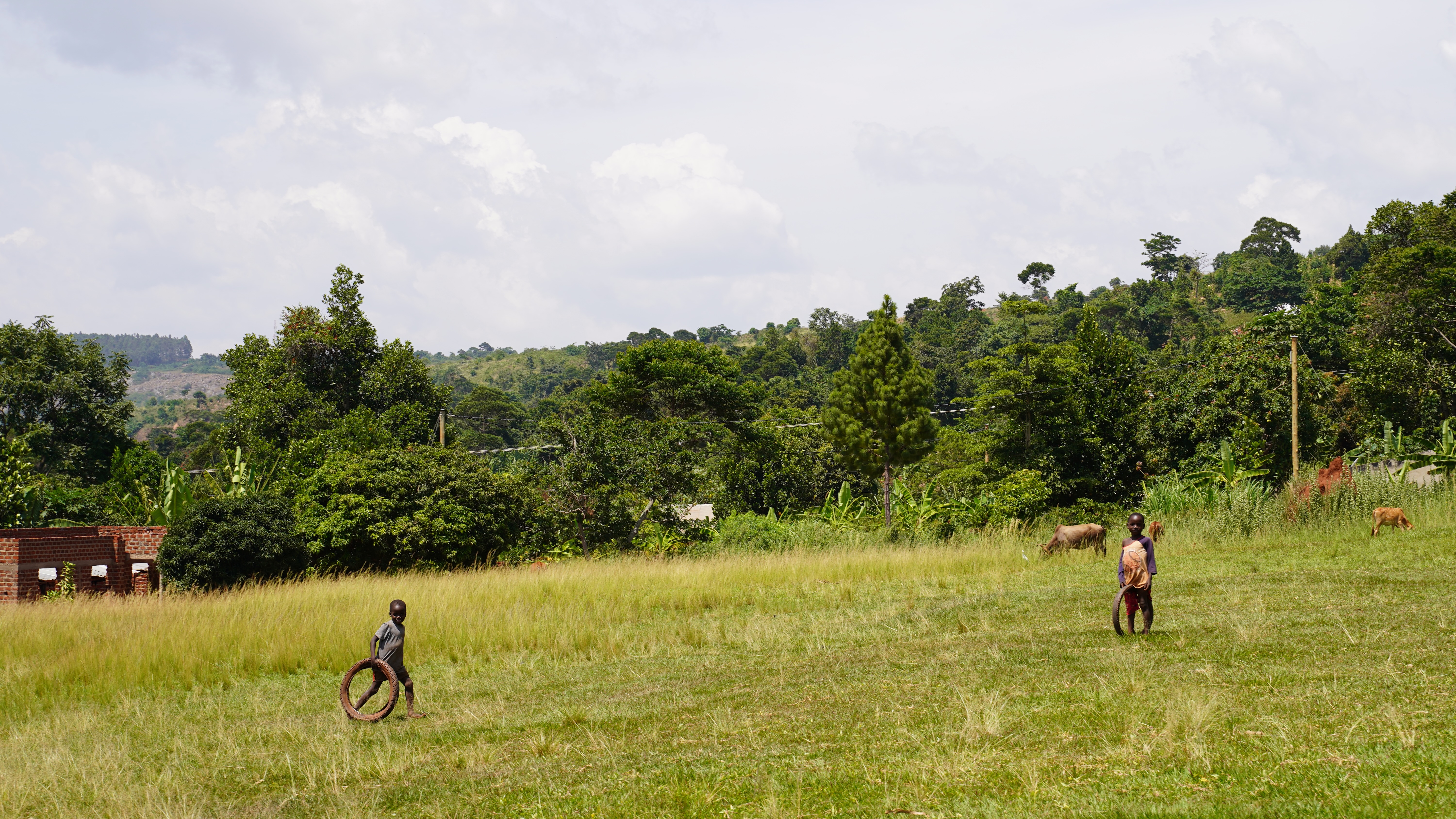 Children playing in the fields near Kisimba, Uganda. Photo: Caspar Haarløv