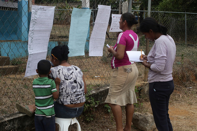 Parents collecting homework for their kids Nicaragua photo
