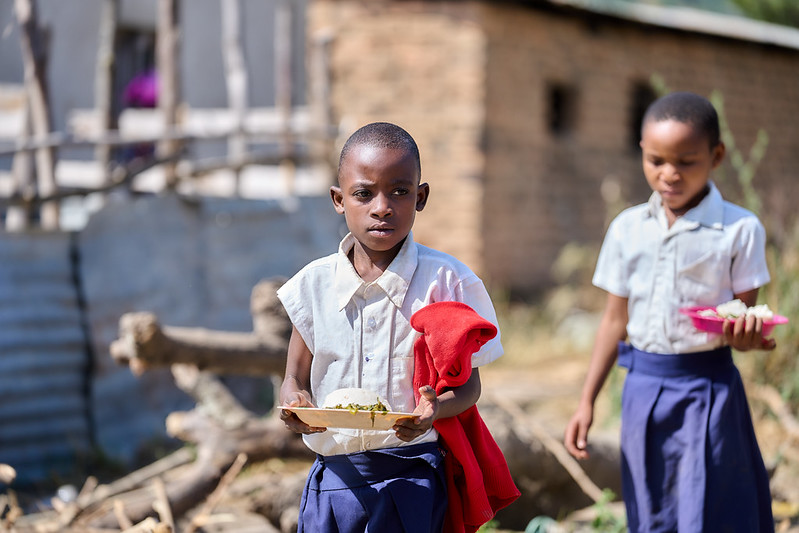 Students at Idugumbi Primary School, Mbeya, Tanzania, enjoy their lunch, thanks to the school feeding program. Credit: GPE/Mrutu (Trans.Lieu)