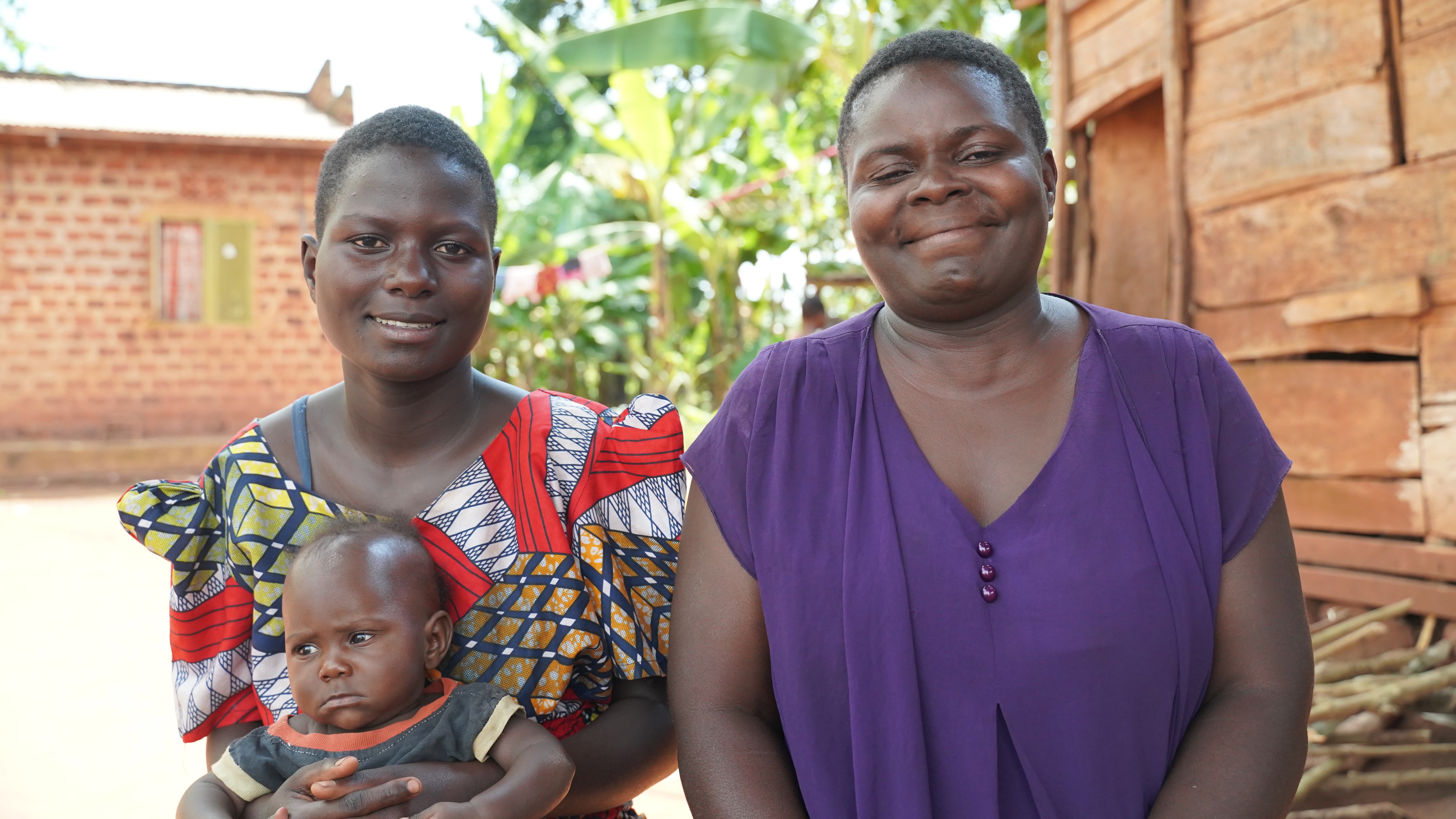 Namuswe Sylvia, 15, with her one-year-old son, and her mother, 29. Photo: Caspar Haarløv